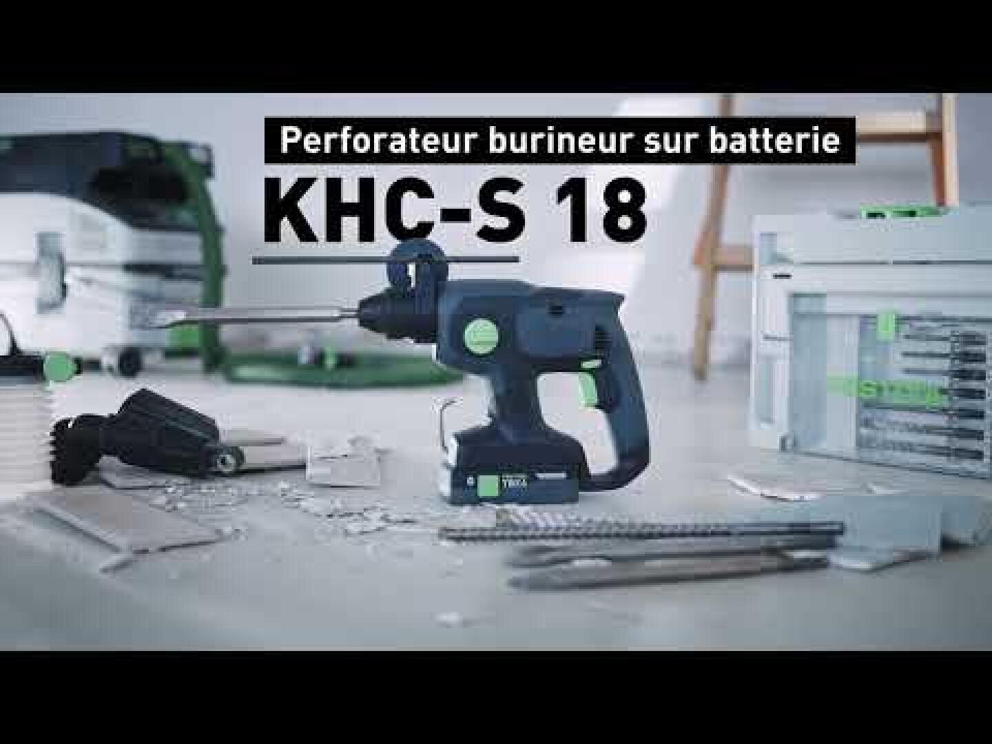 Un marteau perforateur sans fil, portant la référence KHC-S 18, repose sur le sol au milieu d'outils et de débris. Le texte en français au-dessus indique : « Perforateur burineur sur batterie ».